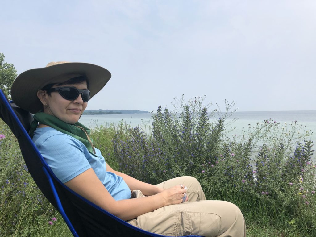 Susan at the Leslie spit in a sunhat.